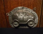 Antique Easter two part chocolate mold of a Family Bunnies riding car by H.Walte