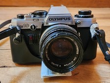 Olympus OM-10 35mm SLR Film Camera with 50mm lens leather strap and case Japan