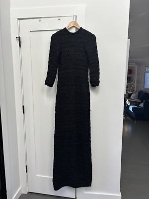 balenciaga black dress label This Cristobal Balenciaga dress is extraordinary. It is from the Winter 1954 Haute Couture collection and I died a small happy vintage death when I saw it in person for the first