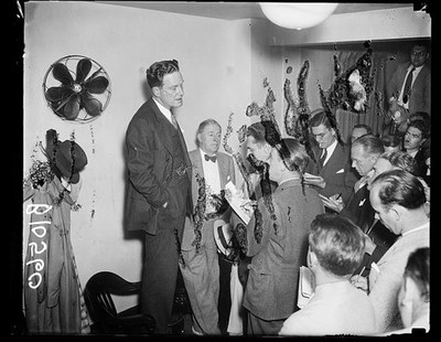 Photo:[John Hamilton with press?]
