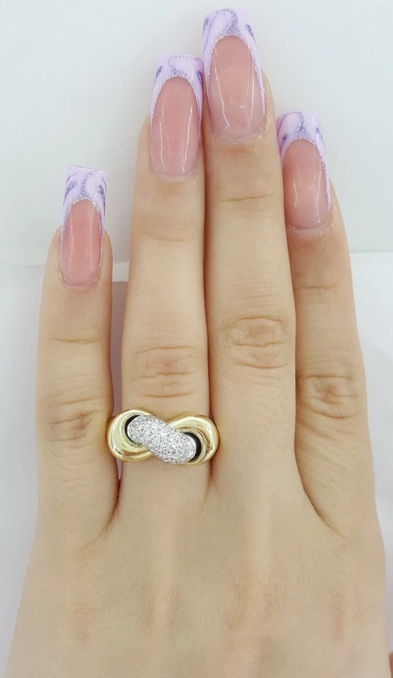 Conjunto de monedas Roberto anillo nudo infinito diamante 0,64 quilates oro amarillo 18k Foto 2 de 4