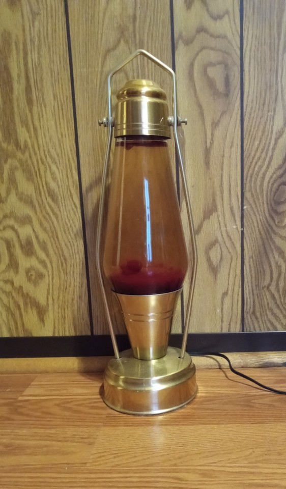 A 1970s CoachLite lava lamp with red wax — CoachLite is a rarer brand than Lava Lite and these 50-year-old originals are genuine shelf trophies for serious collectors.