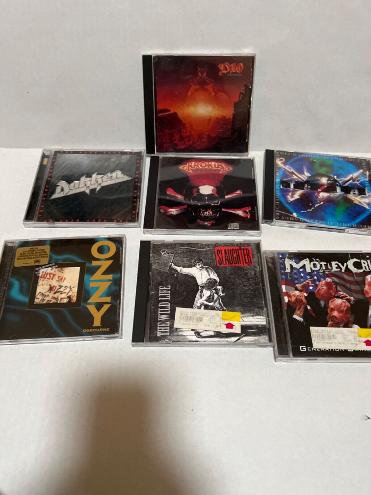 Lot of 7 CDs Ozzy, Krokus, Dokken, Dio, Motley Crue, Slaughter, Tesla