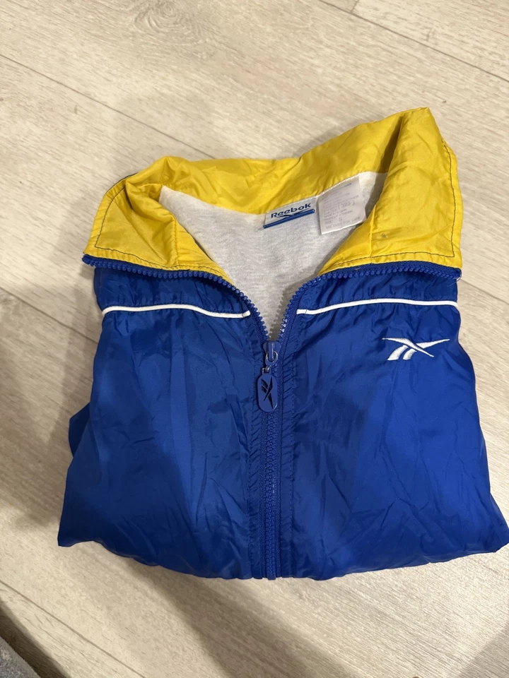 Chaqueta cortavientos vintage Reebok para mujer S azul amarillo traje de pista cremallera completa años 90 Foto 2 de 4