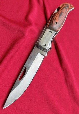  Lockback Folder. 8.5'' O/A  with 4'' Staight Back Blade & Hardwood Grip.