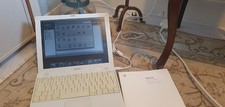 Vintage Apple iBook G4 with User Guide and Replacement Charger.