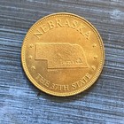 Shell’s States of the Union Coin Game Version 1 Nebraska Brass Token  — photo 1