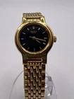 Thin Gold-Tone Ladies' Seiko Quartz Watch with Black Round Dial