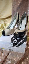 Women's Nine West back and beige pump, Peep toe in size 6.5