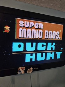 Nintendo NES Console Lot with 2 Controllers, 1 Zapper, 7 Games, and Cords