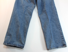 Blue VTG Lucky Brand jeans with 34x30 medium wash, front seam detail, and brown paint splatter on left leg.