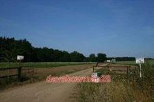 PHOTO  FIELD ENTRANCE NEAR HERRINGSWELL MANOR THERE ARE FOUR GOML SIGNS (ONE OUT