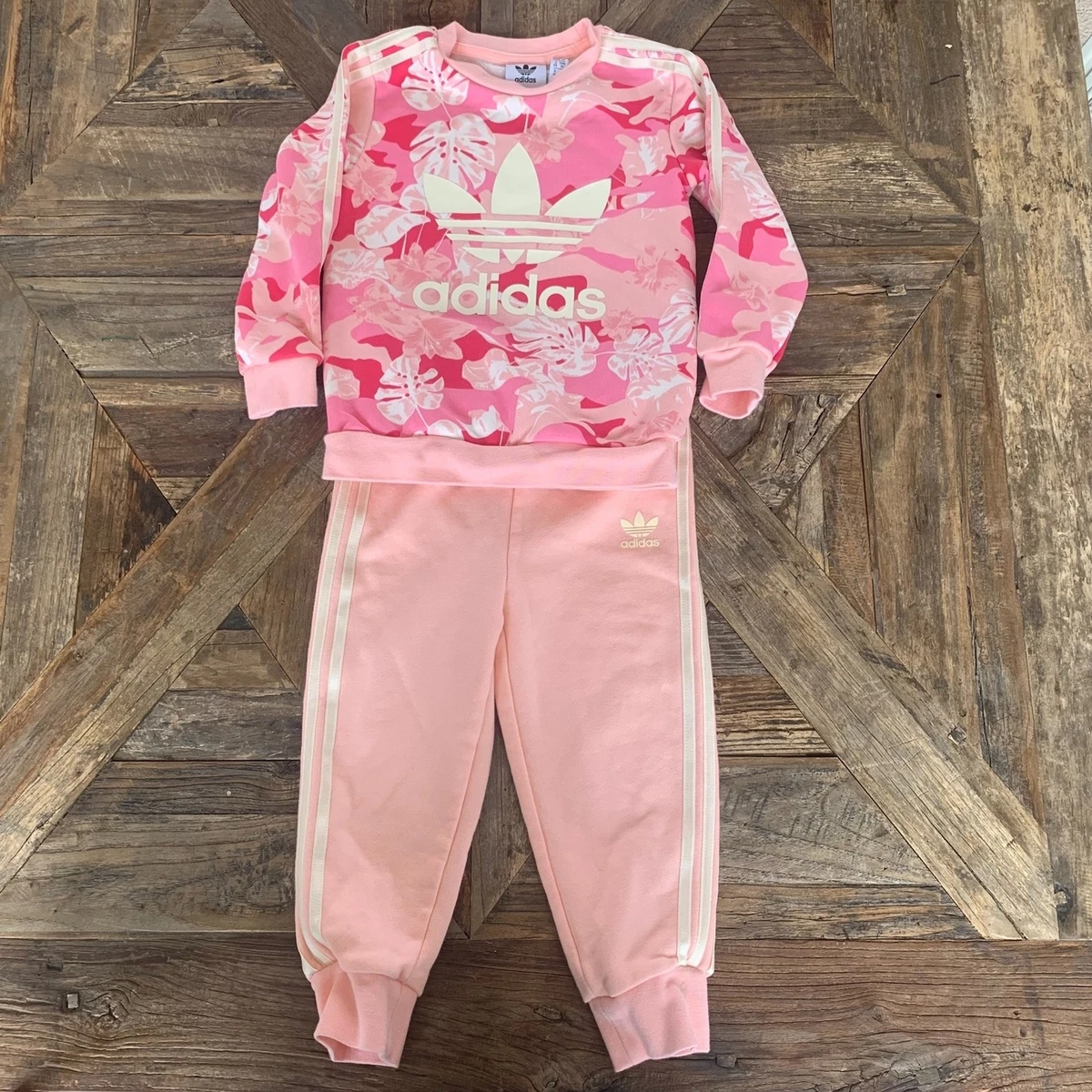 Adidas tracksuit store with flowers