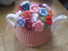HAND KNITTED FLORAL TEA COSY. XMAS BOUQUET.