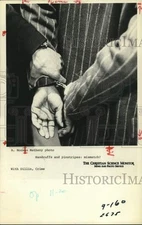 1978 Press Photo Person wearing pinstripes put in handcuffs. - hpa13755