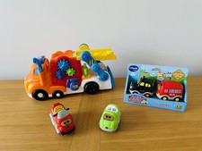 Transportador de vehículos y 4 vehículos VTech Toot Toot Drivers