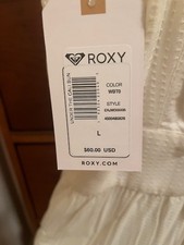 roxy spaghetti strapped mini sundress with two side pockets in cream color