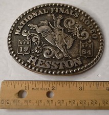 1984 HESSON NATIONAL FINALS RODEO METAL BELT BUCKLE FRED FELLOWS