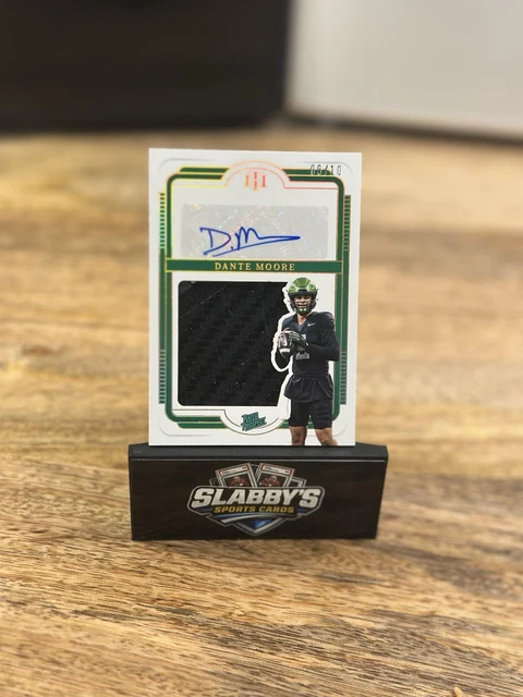 2025 Panini National Treasures Collegiate Dante Moore RPA Gold /10 Glove Patch
