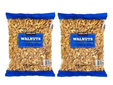 Paquete de 2 nueces Kirkland Signature de 3 lb cada paquete, total 6 libras.
