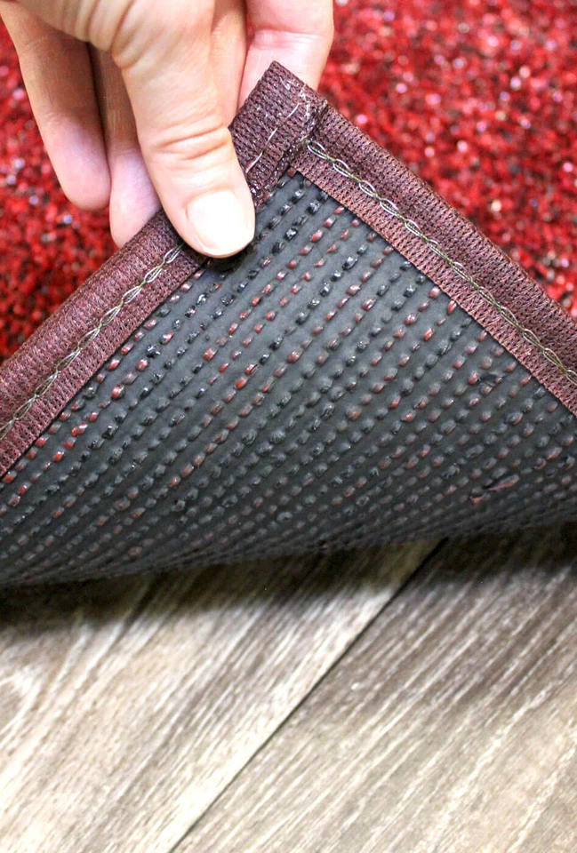 Alfombra rectangular de césped económico Koeckritz - césped artificial exterior rojo y negro Foto 4 de 4