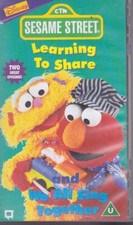 Sesame Street: Learning To Share/We All Sing Together [VHS] [VHStape]