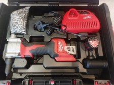 Milwaukee M12 BPRT pop rivet tool with battery and charger