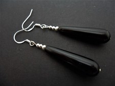 A PAIR OF LONG BLACK ONYX TEARDROP EARRINGS WITH 925 SOLID SILVER HOOKS. NEW..