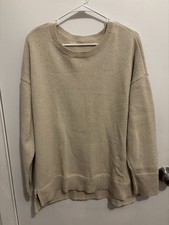 DKNY women's crew/scoop neck sweater. Soft knit in a versatile cream tone.