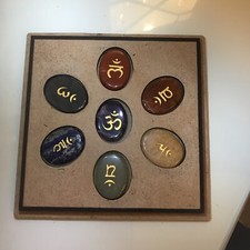 set of chakra balancing healing stones in a box