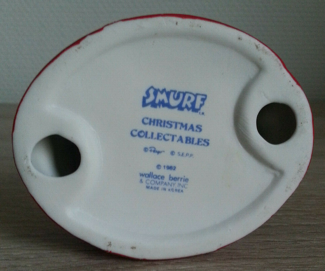 Figurine Schtroumpf - Schtroumpfette en mère Noël avec un cadeau