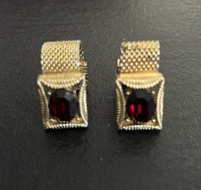 Swank gold-tone mesh cufflink with large rectangular red faceted glass stone