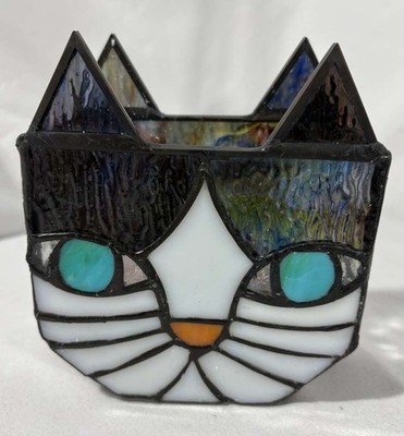 This is a Tiffany-style stained glass planter shaped like a cat's face,