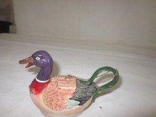 duck shape figurine well made used has small cover n space with chain