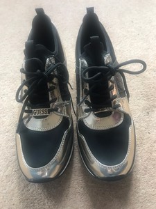 black and gold guess trainers
