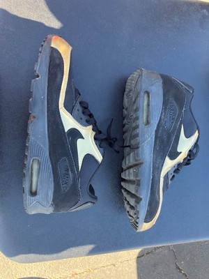 Nike Air Max 90 Essential sneakers in a black and metallic gold