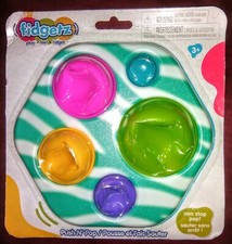 New. damage Packaging FIDGETZ PUSH N POP TOY Ages 3 Multicolor Fidget Toy