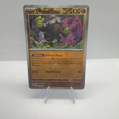 Okidogi 057/131 Pokeball Reverse Holo Pokemon Card Prismatic Evolutions NM