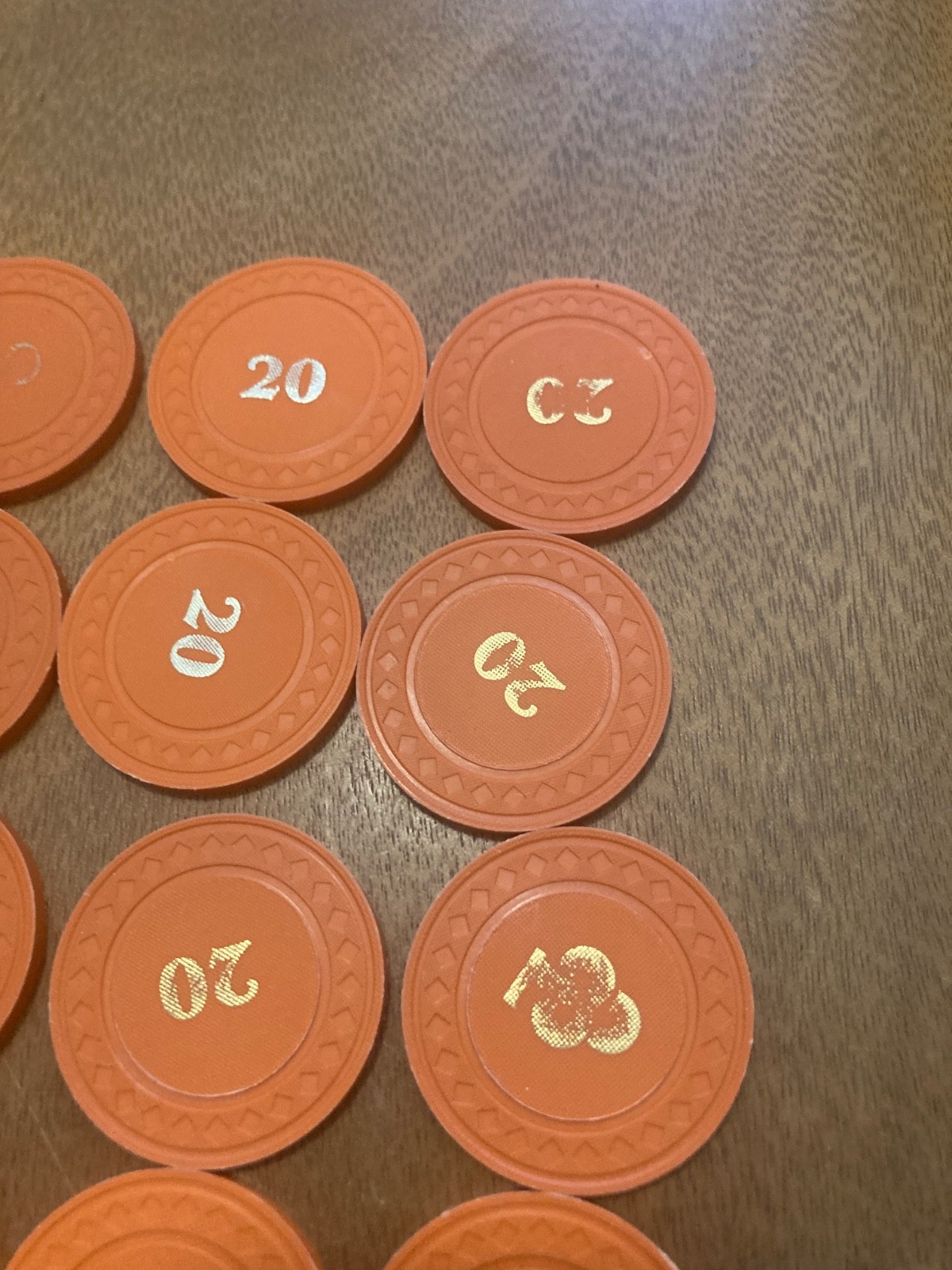 20 ORANGE CLUB 20 POKER CHIPS UNKOWN USE OR LOCATION