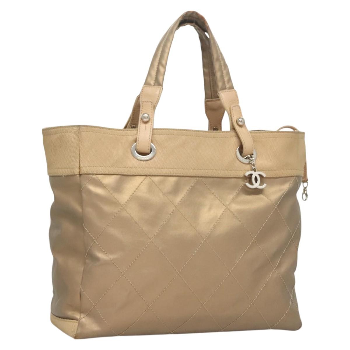 CHANEL Biarritz MM Tote in Beige Coated Canvas with Silver CC Logo bs26552