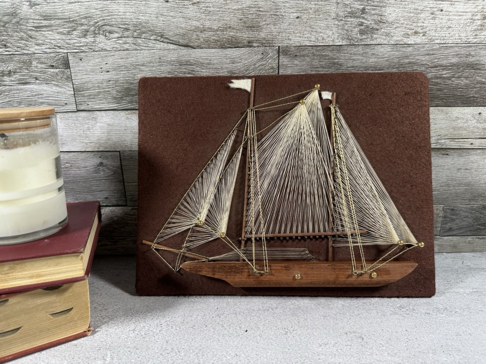 Authentic 1970s handmade string art of a schooner — the kind of tactile, geometric wall piece that looks incredible in a den or study and can't be replicated by an algorithm.