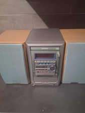 Aiwa XR-M150 micro compact stereo system, featuring a silver center unit