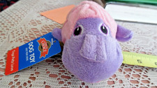Small stuffed plush dog toy with squeaker