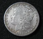 1902 s - MORGAN SILVER  DOLLAR  -  XF /EF  - Rim Dings Reverse