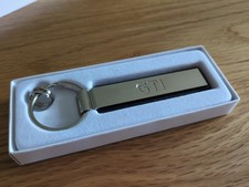 Original VW Schlüsselanhänger GTI Schriftzug Metall silber 000087010F YPN