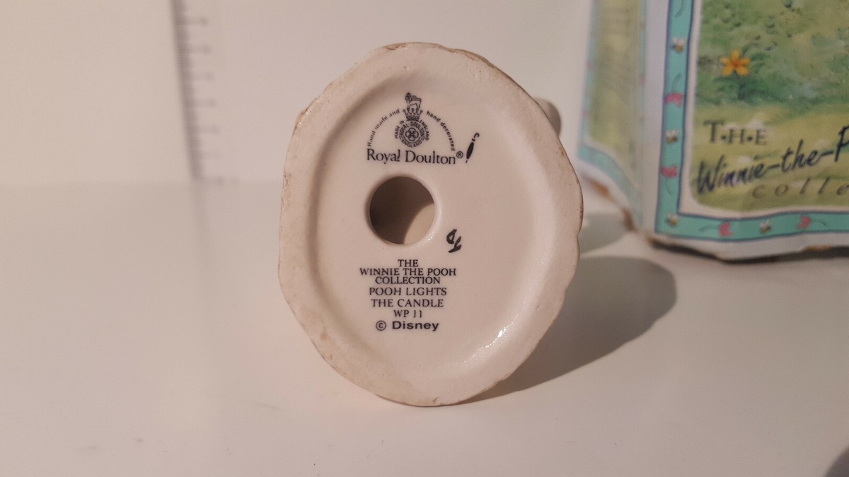 Lot 223 a) Disney Royal Doulton Winnie the Pooh - pooh lights the 