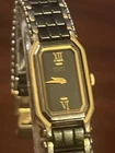 Vintage Seiko 2E20-5749 Ladies Tank Dress Watch Black Gold Roman Dial Quartz