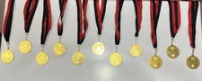 Lot of 11 Gold-Colored Award Medals   Red  Black Ribbons   Generic