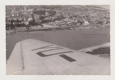 Cityscape View from an Airplane Wing of the Aircraft Intrudes Unusually in Photo