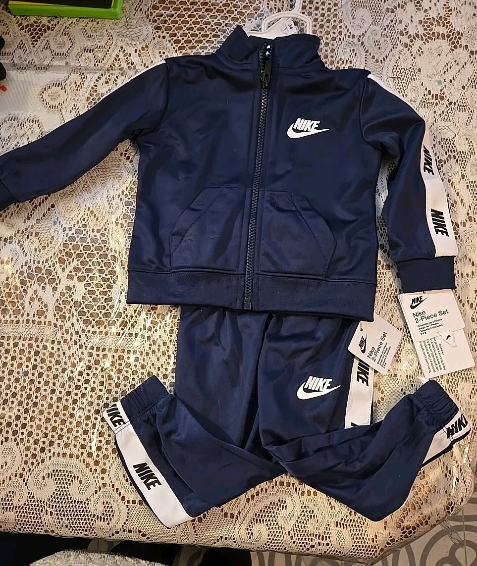 blue and black nike jogging suit